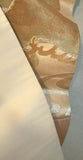 This silk obi has gold-colored thread that seems to radiate sunlight. It has a sturdy oyster-colored backing